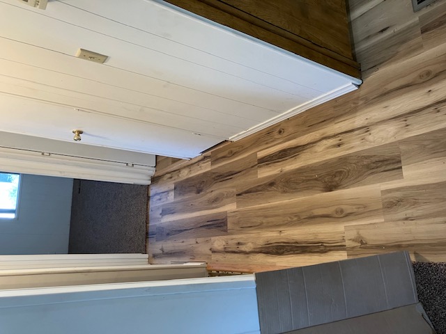 Hallway with new luxury vinyl plank (LVP) flooring in Exeter CA mobile home, Unit 101