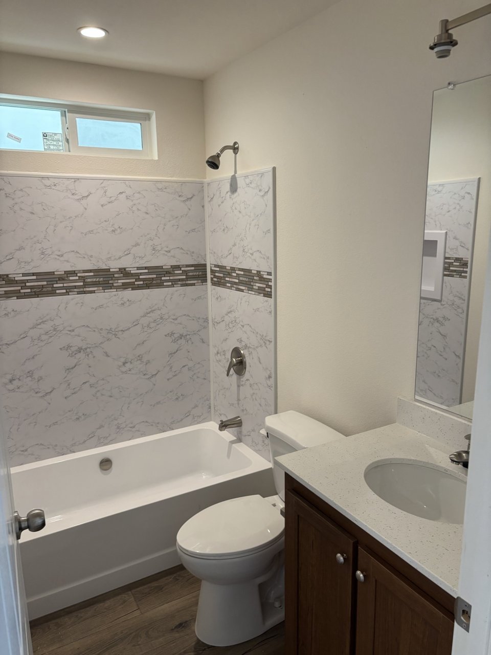 Bathroom with a vanity and tub-shower combination